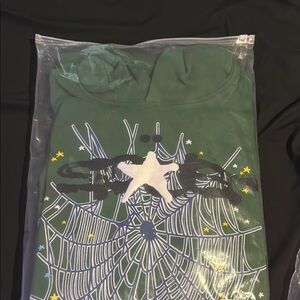Green Tee with Star and Web Graphic